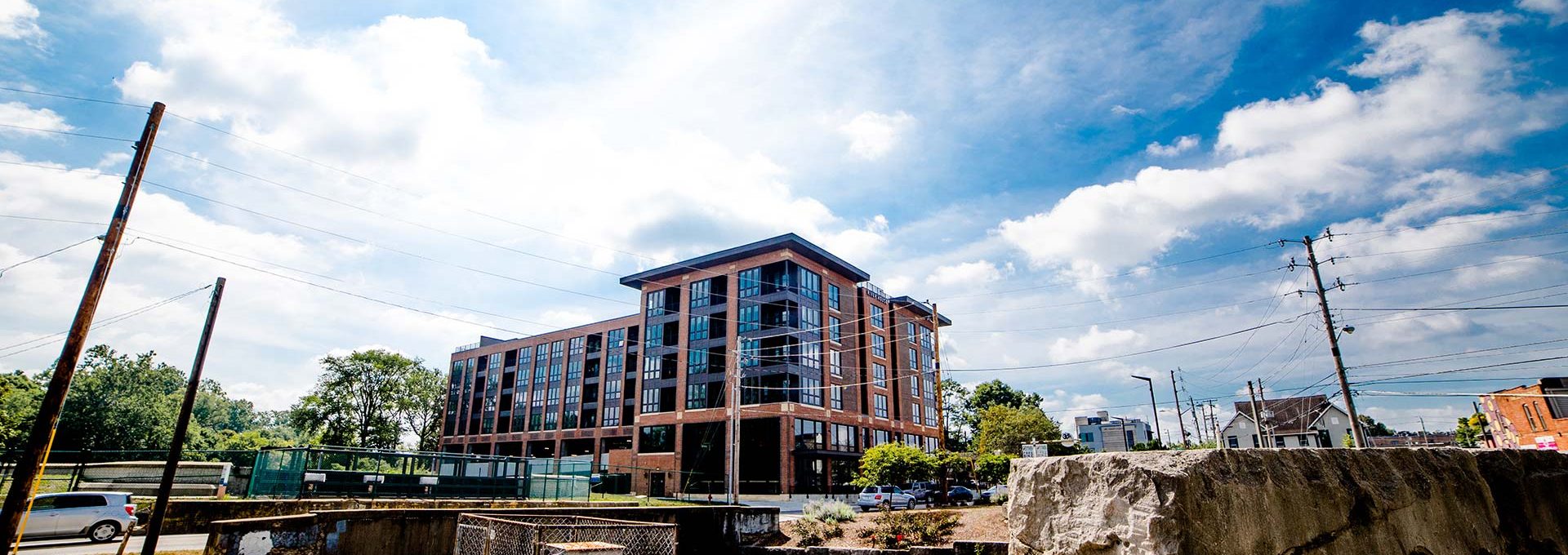 a large building is seen in the distance at The River House