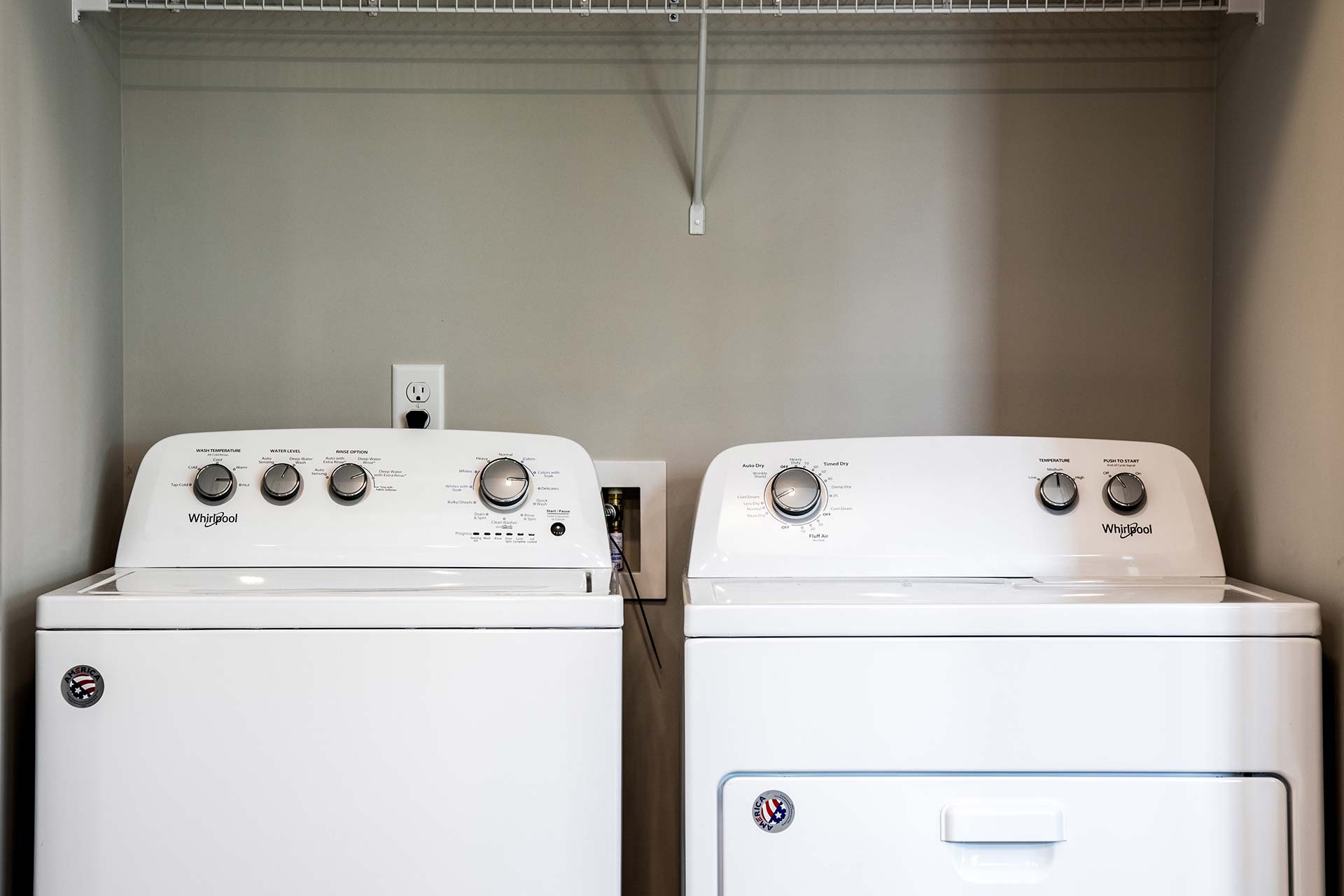 a washer and dryer in a small laundry room at The River House