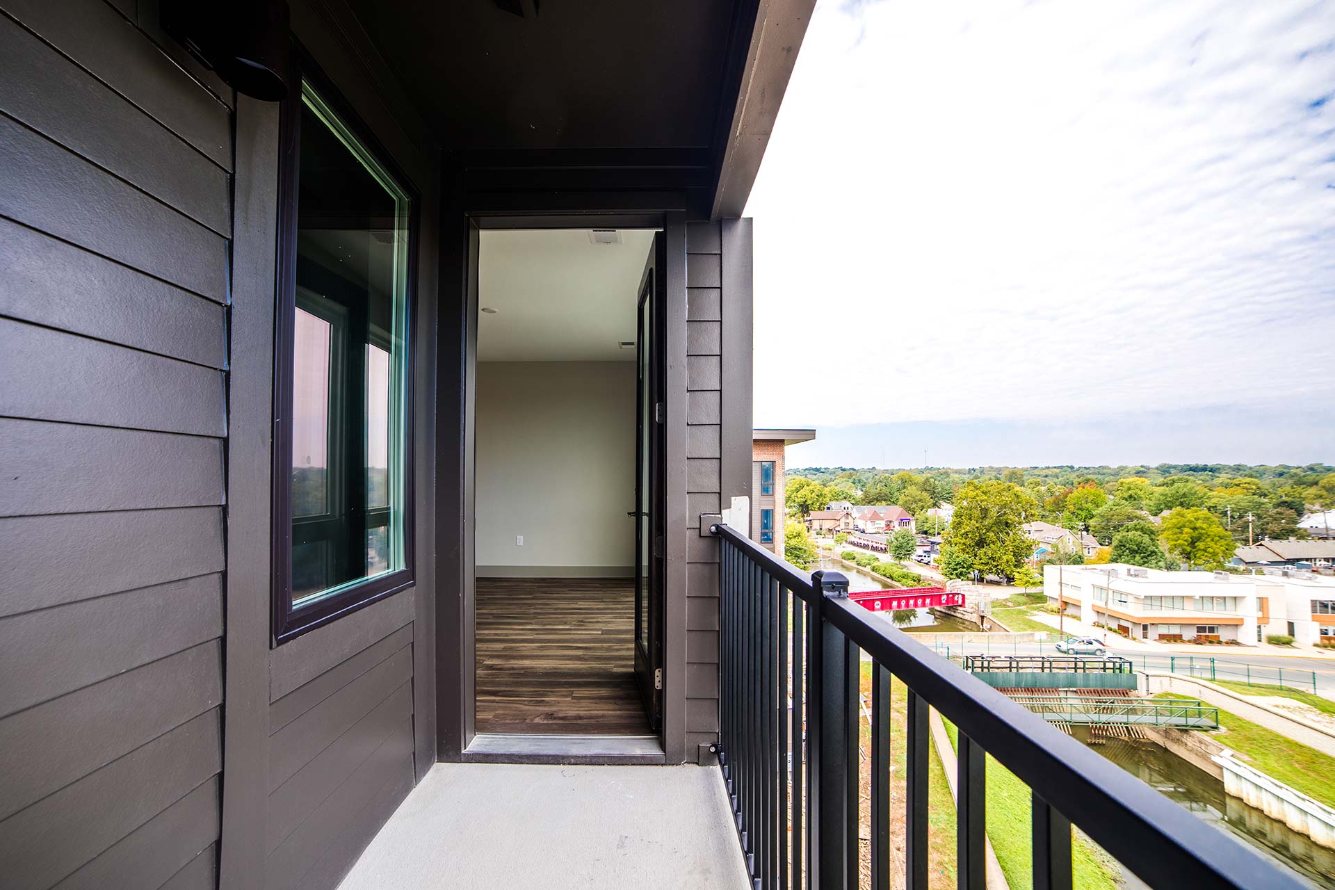 the balcony of a condo with a view of the city at The River House
